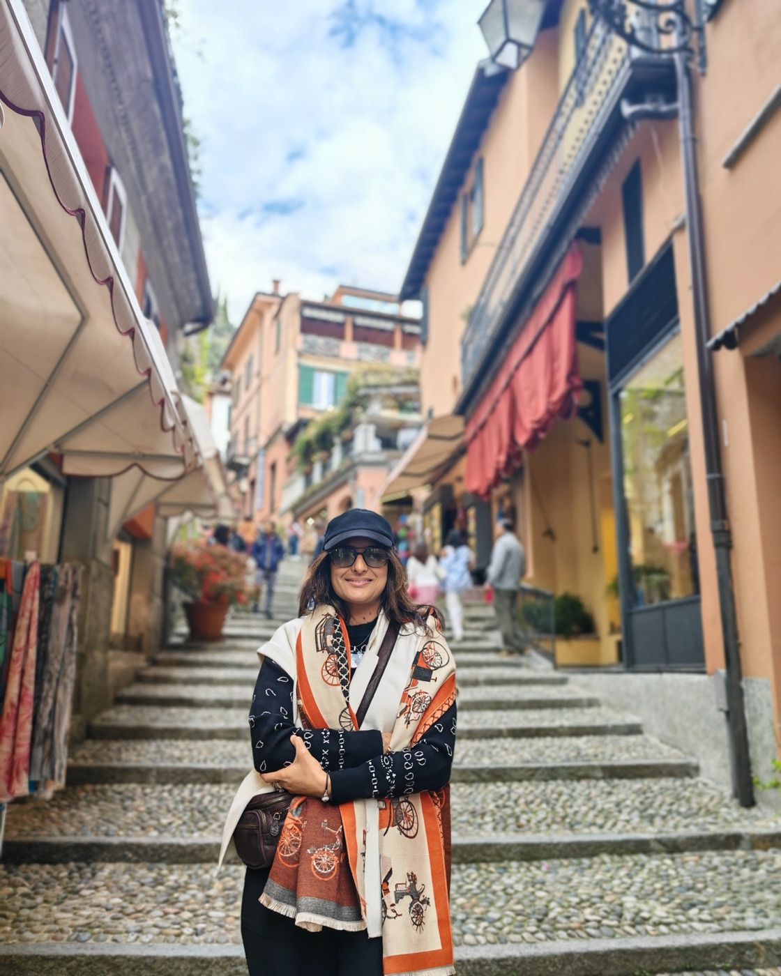 Pallavi on a stepped shopping street of a lake town